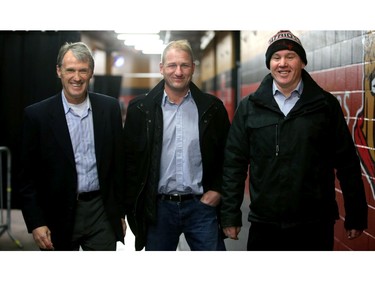 From left, Laurie Boschman, Brad Smythe and Shaun Van Allen arrive at the rink.