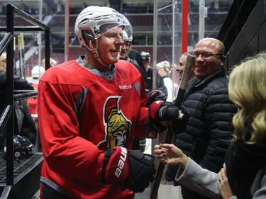 Daniel Alfredsson greets an old friend coming off the ice on Thursday, Dec. 14, 2017.  Ottawa Senators alumni took to the ice for a warmup for their big game Friday night on Parliament Hill.