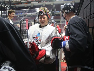 Patrick Lalime is all smiles as he comes off the ice.