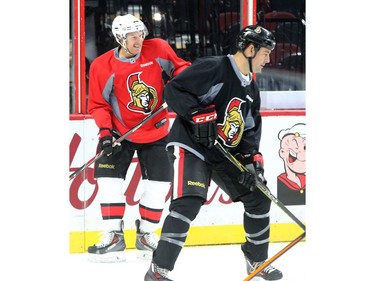 The two captains of the upcoming game, Chris Phillips and Daniel Alfredsson.