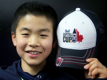 Koichiro Matsudaira, from Japan's Chunichi team, proudly holds up his Bell Capital Cup hat.