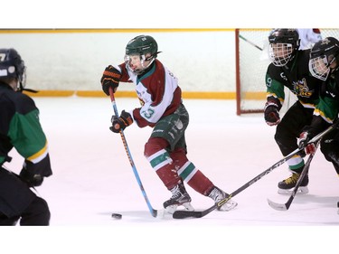 Finland's Siltanen Aleksi turns the puck away from his own net.