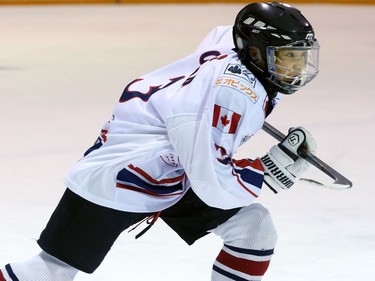 Iori Okada skates for the puck during his team's matchup against the Osgoode Romans.