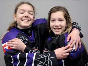 Yukon team members Kalina Morrison (left) and Tess Morin didn't seem fazed by a 5-0 loss to Alberta on Friday in the Canada 150 girls division of the tournament at the Richcraft Sensplex in Gloucester.  Julie Oliver/Postmedia