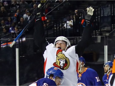 Senators winger Bobby Ryan rejoices after a puck glanced off his skate and into the net for Ryan's first goal of the NHL season.
