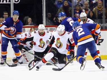 NEW YORK, NY - DECEMBER 01: Nate Thompson #17 and Matt Duchene #95 of the Ottawa Senators look to block a shot in the final minute of their 6-5 victory over the New York Islanders at the Barclays Center on December 1, 2017 in the Brooklyn borough of New York City.