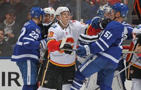 Matthew Tkachuk #19 of the Calgary Flames battles against Jake Gardiner #51 of the Toronto Maple Leafs during an NHL game at the Air Canada Centre on December 6, 2017 in Toronto, Ontario, Canada. (Photo by Claus Andersen/Getty Images)