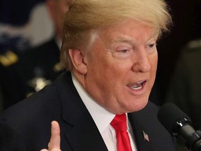 U.S. President Donald Trump speaks before signing the H.R. 2810, National Defense Authorization Act for fiscal year 2018, in the Roosevelt Room at the White House , on December 12, 2017 in Washington, DC.