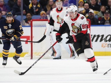 Matt Duchene #95 of the Ottawa Senators skates with the puck as Scott Wilson #20 of the Buffalo Sabres pursues during the first period at the KeyBank Center on December 12, 2017 in Buffalo, New York.