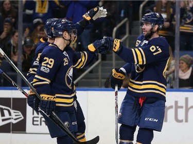 Benoit Pouliot #67 of the Buffalo Sabres celebrates his goal against the Ottawa Senators with Jason Pominville #29 of the Buffalo Sabres during the second period at the KeyBank Center on December 12, 2017 in Buffalo, New York.