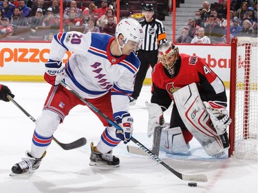 Senators goalie Craig Anderson follows the puck as Chris Kreider of the New York Rangers is in alone.