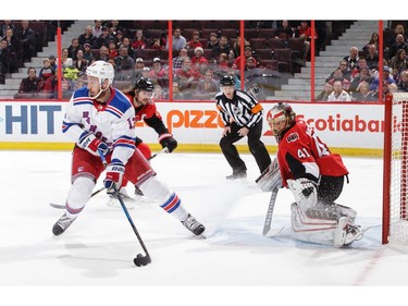 Kevin Hayes of the New York Rangers looks for teammates after skating in alone against Craig Anderson.