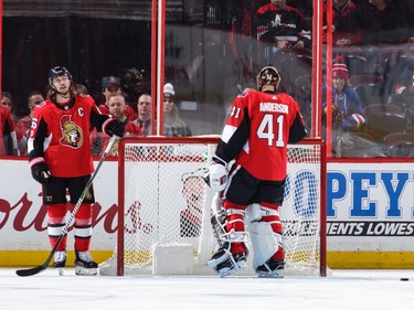 Erik Karlsson and Craig Anderson react after a second-period goal by Michael Grabner of the New York Rangers.