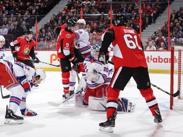 Mark Stone (61) and Bobby Ryan (9) of the Ottawa Senators watch a Cody Ceci shot get past Henrik Lundqvist of the New York Rangers at the Canadian Tire Centre on Wednesday, Dec. 13, 2017.