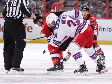 Nate Thompson of the Ottawa Senators takes a faceoff against Boo Nieves of the New York Rangers.