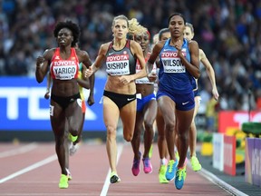 Canada's Melissa Bishop (C), US athlete Ajee Wilson (R) and Benin's Noélie Yarigo compete in the semi-final of the women's 800m athletics event at the 2017 IAAF World Championships at the London Stadium in London on August 11, 2017.