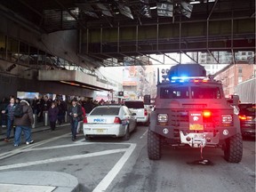 Police and other first responders respond to a reported explosion at the Port Authority Bus Terminal on December 11, 2017 in New York. New York police said Monday that they were investigating an explosion of "unknown origin" in busy downtown Manhattan, and that people were being evacuated. Media reports said at least one person had been detained after the blast near the Port Authority transit terminal, close to Times Square.Early media reports said the blast came from a pipe bomb, and that several people were injured.