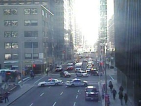 Police block off Queen Street after a pedestrian was struck by a pickup truck Friday morning.