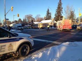 A woman in her 60s was sideswiped by a school bus as she cross Woodroffe Avenue at Iris Street at 3:30 p.m. She was temporarily trapped under the bus when her clothes where caught on the vehicle's undercarriage.