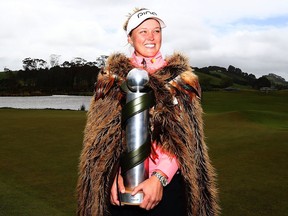 Brooke Henderson of Smiths Falls poses with the New Zealand Women's Open trophy after winning that LPGA Tour event on Oct. 2, 2017.