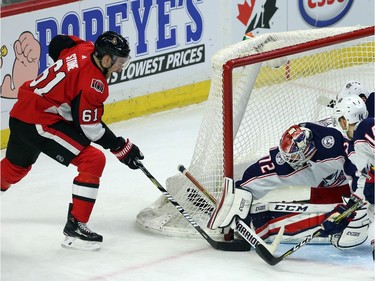 Ottawa's Mark Stone (61) shovels the puck off the skate of Columbus netminder Sergei Bobrovsky (72) and across the line for the winning goal in the third period on Friday night.