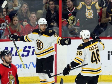 Boston's Ryan Spooner (51) celebrates his second goal of the night with teammate David Krejci (46) during the second period.