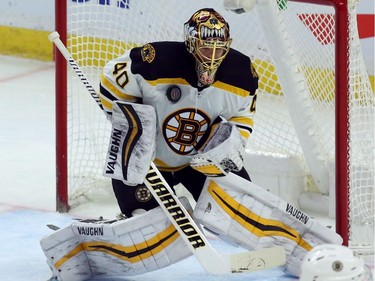Bruins goalie Tuukka Rusk makes a chest save on a routine shot by the Senators during the second period of play.