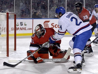 Montreal Canadiens centre Phillip Danault (24) tries to put the puck past Ottawa Senators goalie Craig Anderson (41) during third period hockey action at the NHL 100 Classic, in Ottawa on Saturday, December 16, 2017.