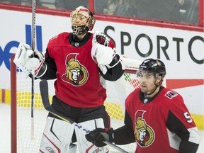 Ottawa Senators goalie Craig Anderson and defenceman Cody Ceci react at the final whistle of a 3-2 win over the Rangers. Both players had strong games.