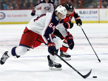The Blue Jackets' Tyler Motte speeds down the ice with Senators captain Erik Karlsson in pursuit in the first period.