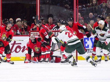 Minnesota Wild's Daniel Winnik attempts to stop a shot with his stick while taking on the Ottawa Senators during second period NHL hockey action in Ottawa on Tuesday, Dec. 19, 2017.