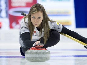 Skip Rachel Homan, from Ottawa, Ont. throws a rock during her Olympic 6-5 win over Team Carey in the 2017 Roar of the Rings Canadian Olympic Curling Trials in Ottawa on Sunday, December 10, 2017. THE CANADIAN PRESS/Adrian Wyld