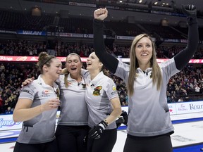 Skip Rachel Homan of Ottawa, Ont. pumps her fists as second Joanne Courtney, third Emma Miskew and lead Lisa Weagle celebrate defeating Team Carey in the women's final at the 2017 Roar of the Rings Canadian Olympic Trials in Ottawa on Sunday, Dec. 10, 2017. THE CANADIAN PRESS/Justin Tang