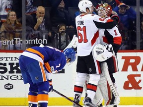 Mark Stone and Mike Condon of the Ottawa Senators celebrate their 6-5 victory over the New York Islanders on Dec. 1, 2017