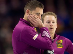 Skip John Morris and lead Tyrel Griffith are seen during fourth end Olympic curling trials action against Team Gushue on Dec. 4, 2017
