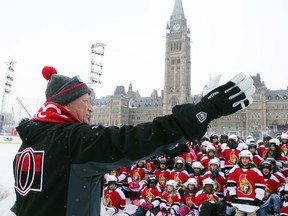 Eugene Melnyk, owner of the Ottawa Senators, addresses close to 100 kids on Parliament Hill in Ottawa on Dec. 10, 2017