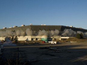 Detonations can be seen during an attempted implosion of the Silverdome, in Pontiac, Michigan, Sunday, Dec. 3, 2017. Technical problems with the explosives left the stadium still standing after the blast.