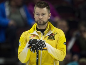Skip Mike McEwen of Winnipeg watches an opponent's rock enters the house during the Olympic curling trials action on Wednesday morning at Canadian Tire Centre.