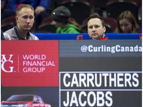 Skip Brad Jacobs, from Sault Ste. Marie, Ont., sits with alternate Peter Steski.