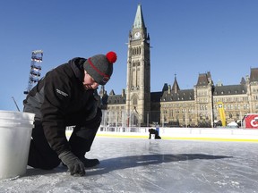 The 19th annual Bell Capital Cup officially got underway at the Canada 150 hockey rink on Parliament Hill in Ottawa Wednesday Dec 27, 2017. The Brampton Canadettes (white and blue) and the Kanata Rangers made it through the first period of the 10:10 a.m. game Wednesday before it was called off due to poor ice conditions as a result from the weather being too cold. Ryan Caron from Capital Sports Management fixes some ruts in the damaged ice Wednesday.    Tony Caldwell