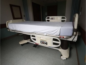 An empty patient bed.