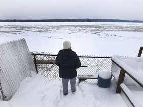 Sylvie Goneau looks out to the Ottawa river in the backyard of her rebuilt home in Gatineau Tuesday Dec 19, 2017. Goneau and her family decided to rebuild on Blvd Hurtubise in Gatineau after the major flood. Tony Caldwell