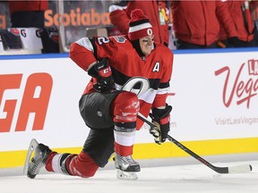 Dion Phaneuf stretches in the warm up period as the Ottawa Senators take on the Montreal Canadiens in the 2017 Scotiabank NHL 100 Classic outdoor hockey game at TD Place in Ottawa.