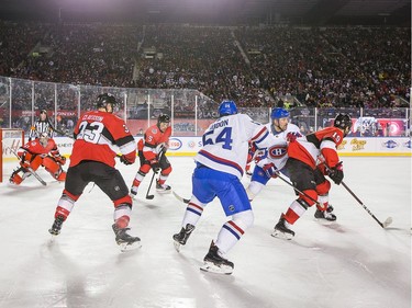 Action in the Senators end in the second period as the Ottawa Senators take on the Montreal Canadiens in the 2017 Scotiabank NHL 100 Classic outdoor hockey game at TD Place in Ottawa.  Photo by Wayne Cuddington/ Postmedia