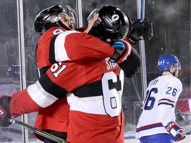 Bobby Ryan is congratulated on his goal by Mark Stone as Jeff Petry skates away in the third period as the Ottawa Senators take on the Montreal Canadiens in the 2017 Scotiabank NHL 100 Classic outdoor hockey game at TD Place in Ottawa.  Photo by Wayne Cuddington/ Postmedia