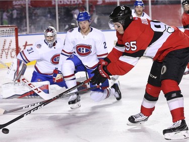 Matt Duchene tries to corral the puck with Jeff Petry and goalie Carey Price looking on in the third period as the Ottawa Senators take on the Montreal Canadiens in the 2017 Scotiabank NHL 100 Classic outdoor hockey game at TD Place in Ottawa.  Photo by Wayne Cuddington/ Postmedia