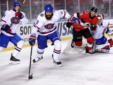 Jordie Benn skates away with the puck as Derick Brassard chases him in the third period as the Ottawa Senators take on the Montreal Canadiens in the 2017 Scotiabank NHL 100 Classic outdoor hockey game at TD Place in Ottawa.  Photo by Wayne Cuddington/ Postmedia ORG XMIT: POS1712162120580331