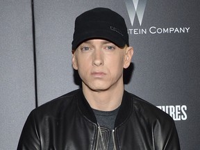 In this July 20, 2015, file photo, Rapper Eminem attends the premiere of "Southpaw" in New York. In a tweet Thursday, Dec. 14, 2017, Eminem said is hosting a promotional event Friday in Detroit in the style of a pop-up restaurant with a menu featuring "mom's spaghetti." The event is to promote his new album, "Revival."