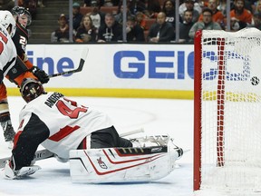 Anaheim Ducks right wing Ondrej Kase, back left, scores against Ottawa Senators goalie Craig Anderson, right, and defenseman Cody Ceci during the second period of an NHL hockey game in Anaheim, Calif., Wednesday, Dec. 6, 2017.
