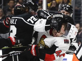 Senators centre Jean-Gabriel Pageau receives a gloved face-wash from the Kings' Tyler Toffoli during Thursday's contest in L.A.